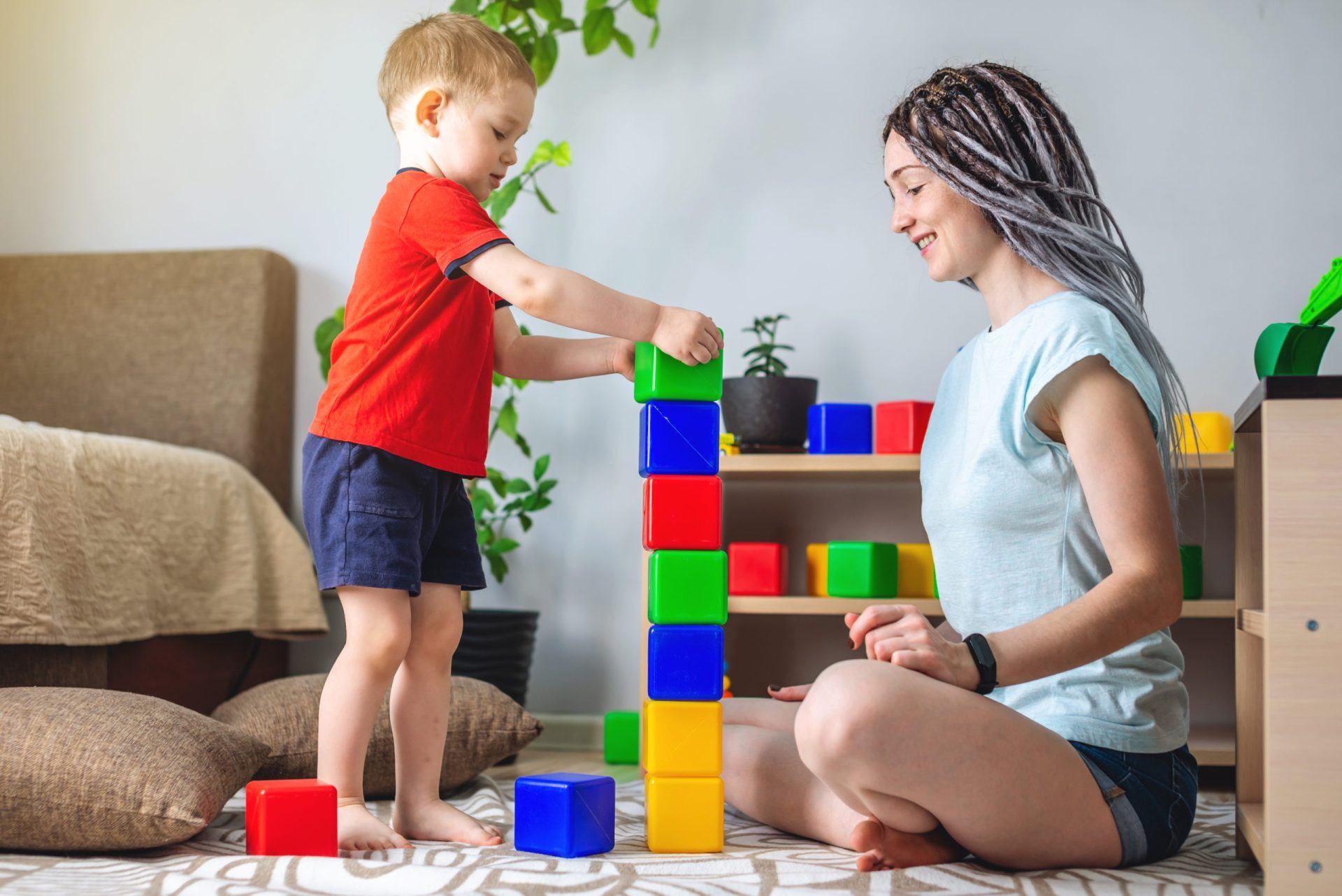 Mom is playing with her child